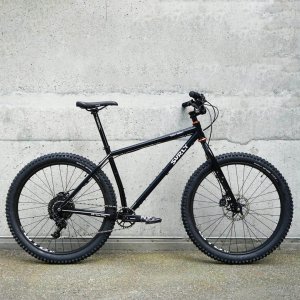 Custom built black Surly Karte Monkey mountainbike with orange details