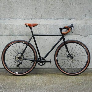 Black surley straggler custom bike with leather saddle and matching grips